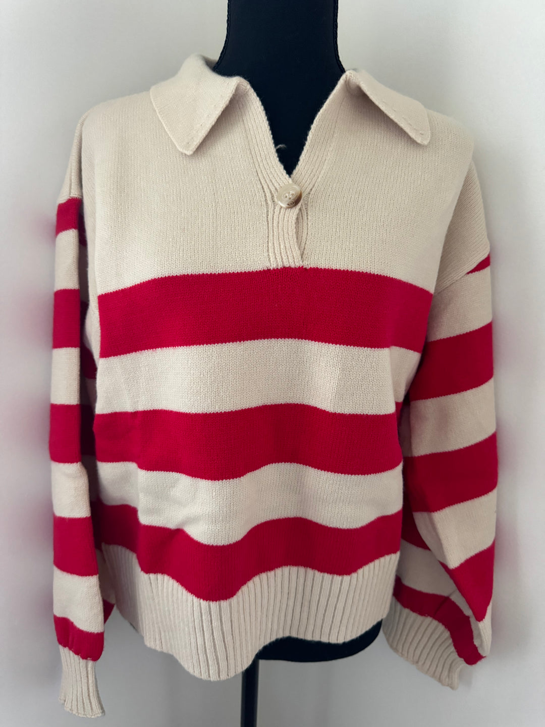 mannequin view of red stripe That’s So 70’s Collared Stripe Sweater with bold horizontal stripes and a relaxed fit, featuring a classic collar with a single button, available at Onyx Native.