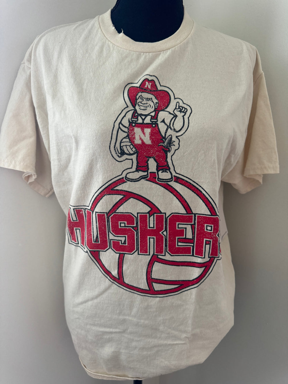 mannequin view of Vintage-inspired University of Nebraska Corn Huskers graphic tee with distressed details.