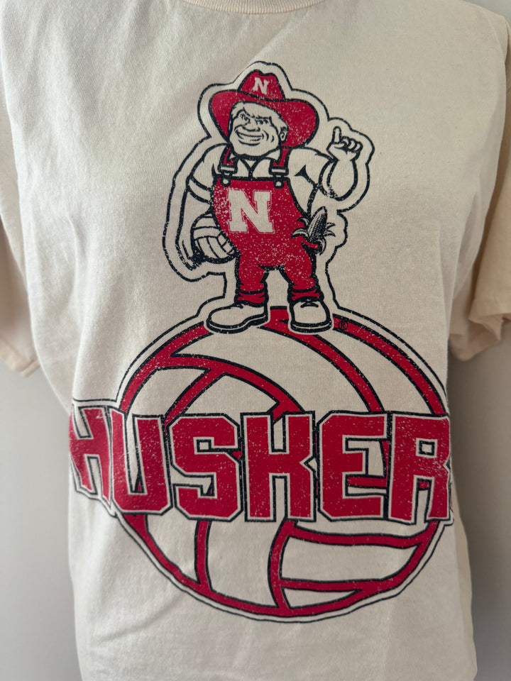 close up view of graphic detail on Vintage-inspired University of Nebraska Corn Huskers graphic tee with distressed details.