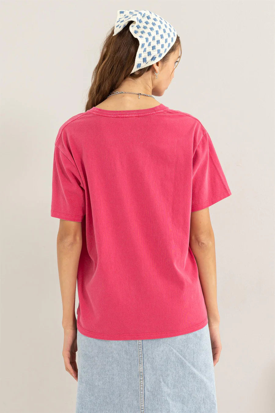 back view of Rita Short Sleeve Tee with a crew neckline and short sleeves, featuring a relaxed fit. Made from 100% cotton for comfort.