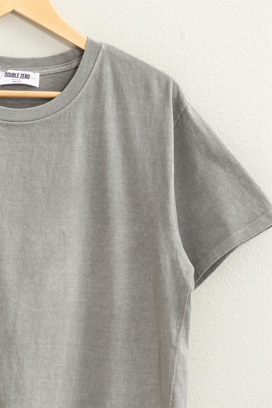 sleeve view of Rita Short Sleeve Tee with a crew neckline and short sleeves, featuring a relaxed fit. Made from 100% cotton for comfort.