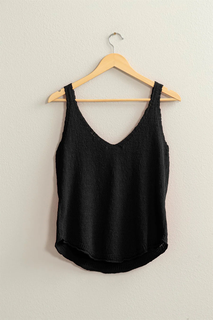 zoomed out view of black colored Terry Sleeveless Top with a V neck and shoulder straps, featuring a relaxed fit. Made from 75% cotton and 25% polyester, ideal for pairing with shorts, pants, or skirts