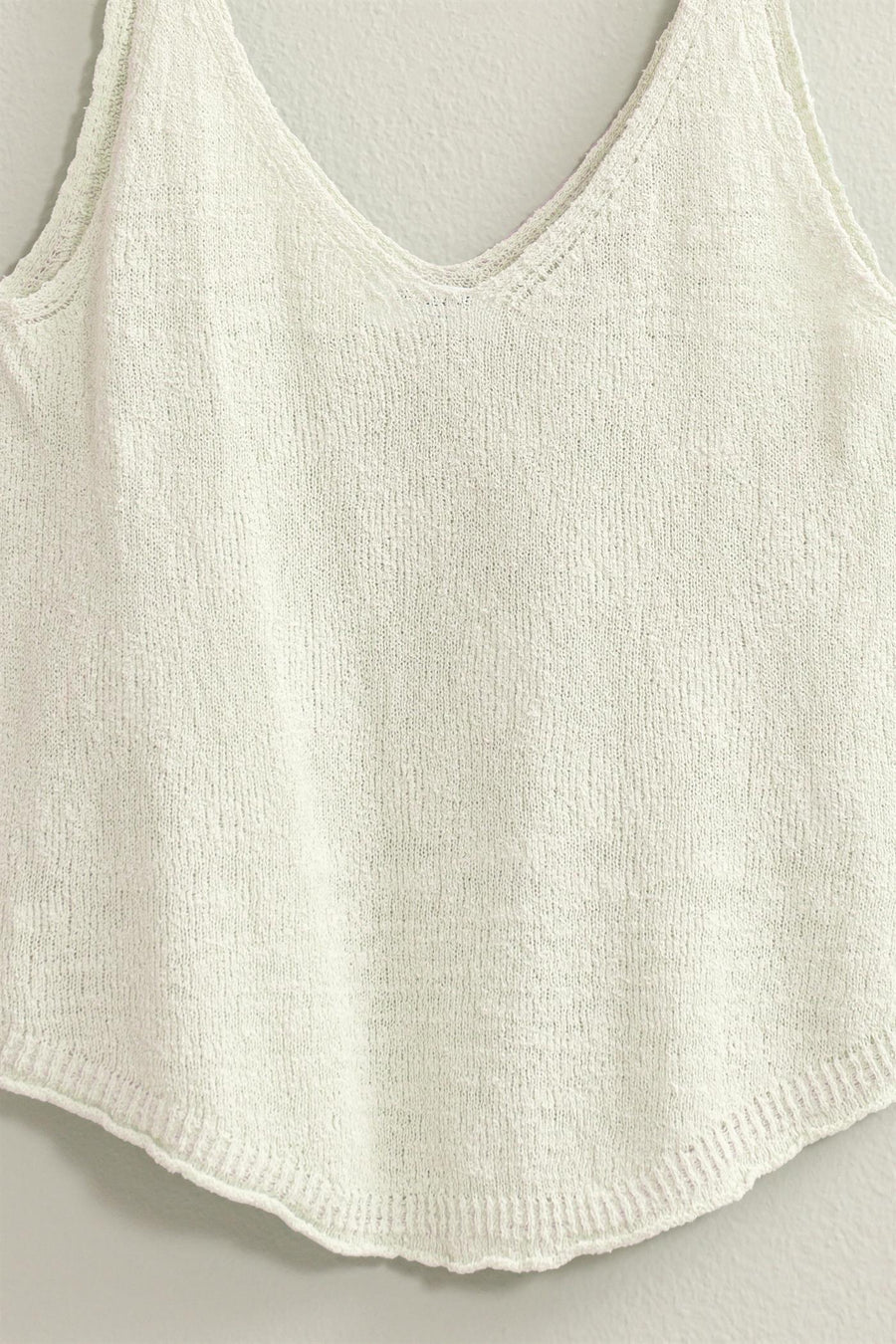 white view of Terry Sleeveless Top with a V neck and shoulder straps, featuring a relaxed fit. Made from 75% cotton and 25% polyester, ideal for pairing with shorts, pants, or skirts