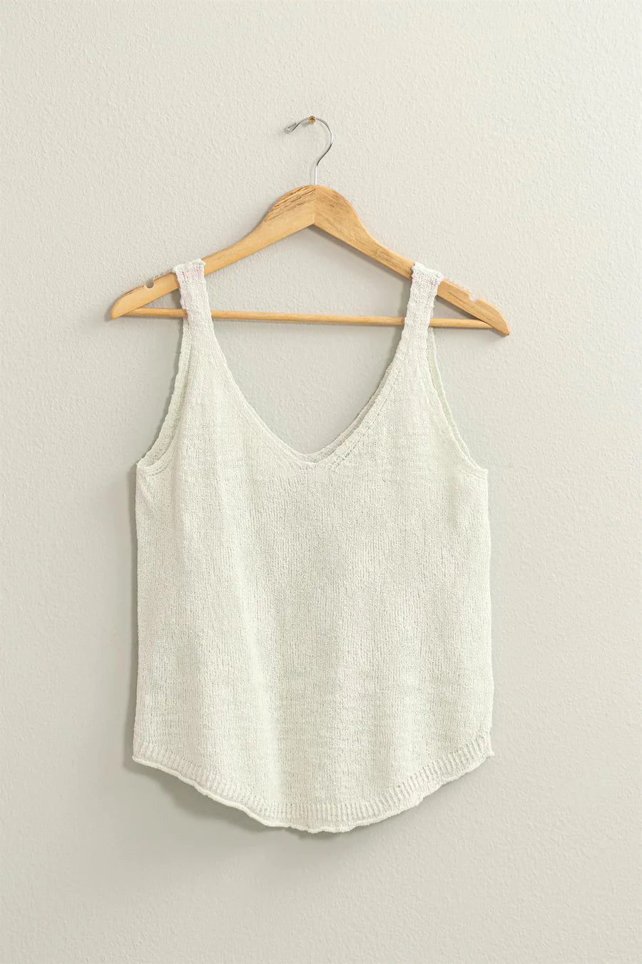 full view of white colored Terry Sleeveless Top with a V neck and shoulder straps, featuring a relaxed fit. Made from 75% cotton and 25% polyester, ideal for pairing with shorts, pants, or skirts