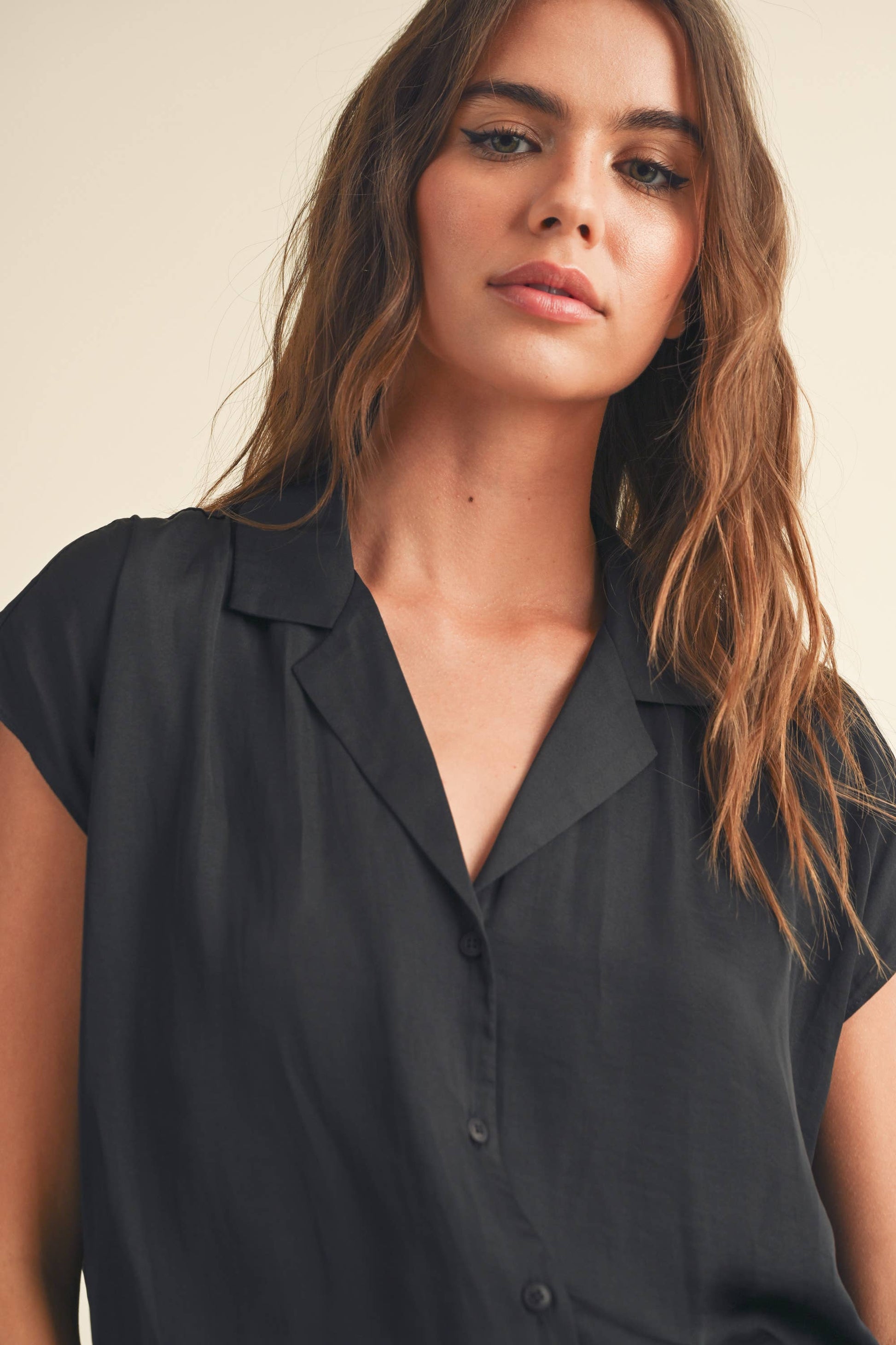 zoomed in front view of Button-down cap sleeve shirt in a light and breathable fabric.