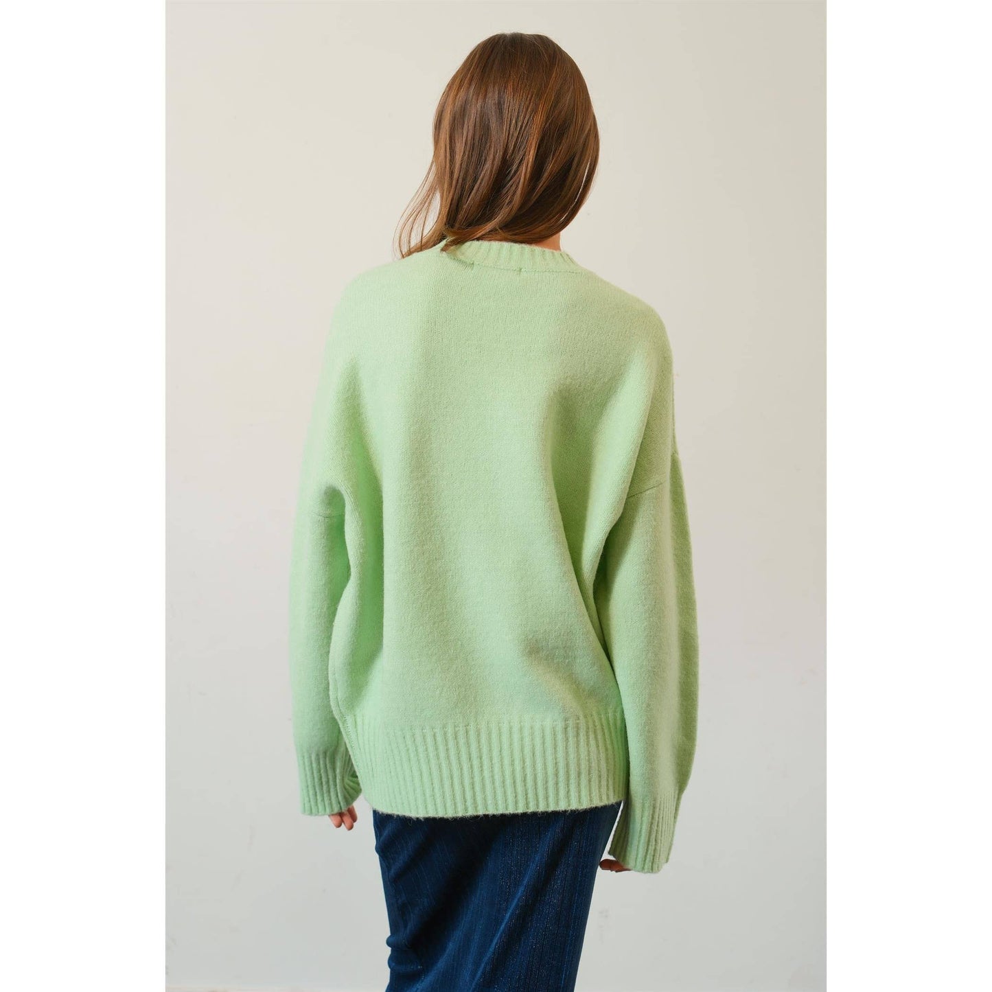 back view of Jade Oversized Sweater Pullover with dropped shoulders and ribbed crew neckline.