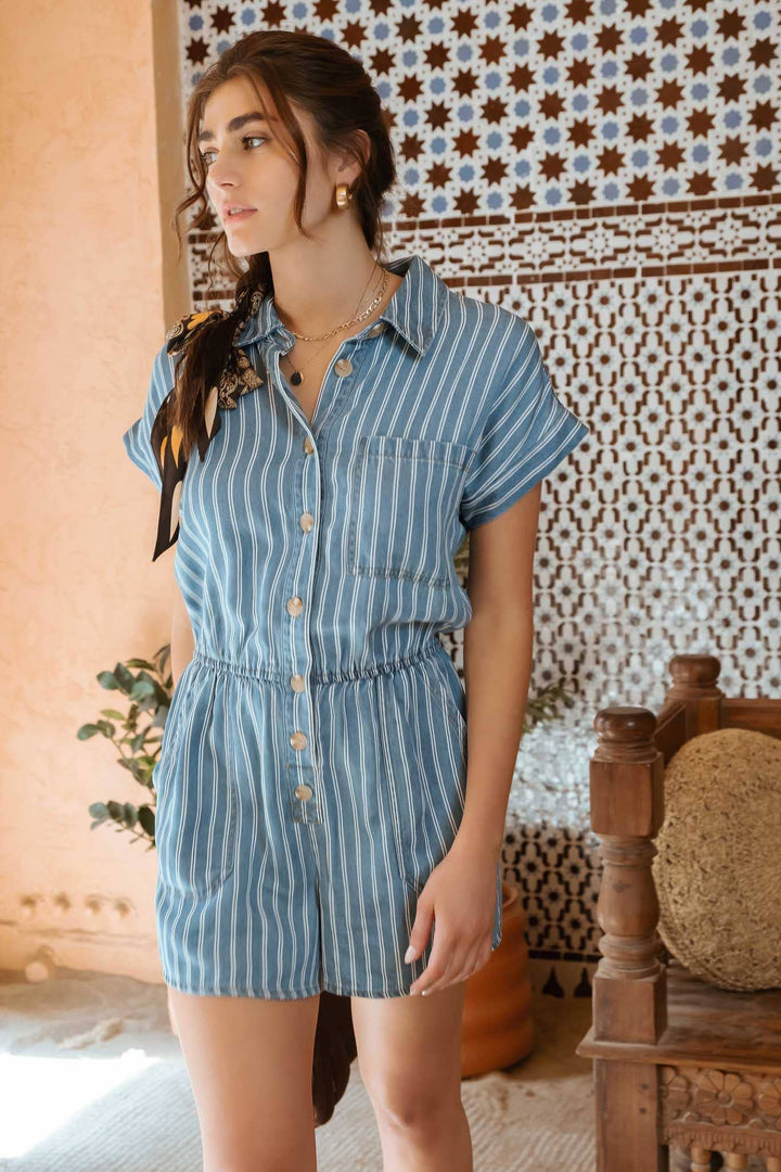alternate styled view of Women's striped button-down romper with collared neck, elastic waist, roll-up sleeves, and pockets, true to size fit, available at Onyx Native.
