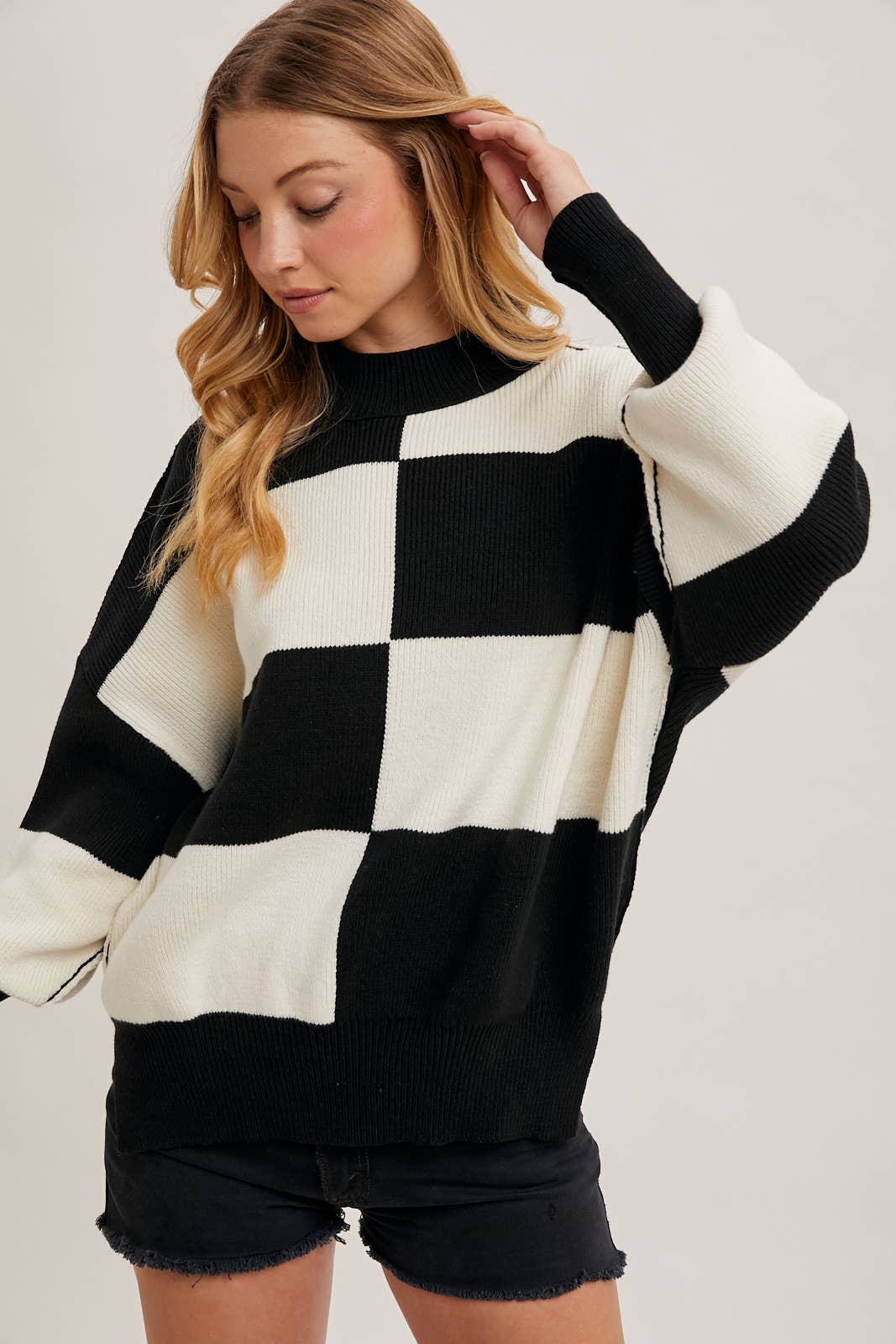 sleeve detail of Black Color Block Sweater with dolman sleeves, soft knit fabric, and a stylish design, perfect for versatile styling, available at Onyx Native.