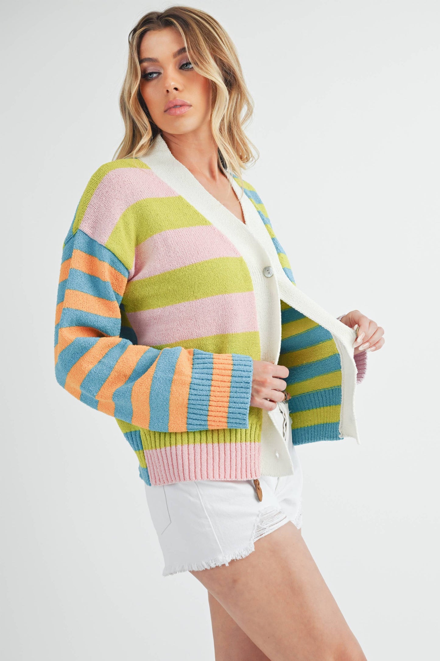 button detail of Flavia Sweater featuring mixed stripes, drop-shoulder design, cashmere-blend fabric, deep V-neck, and front button closure.