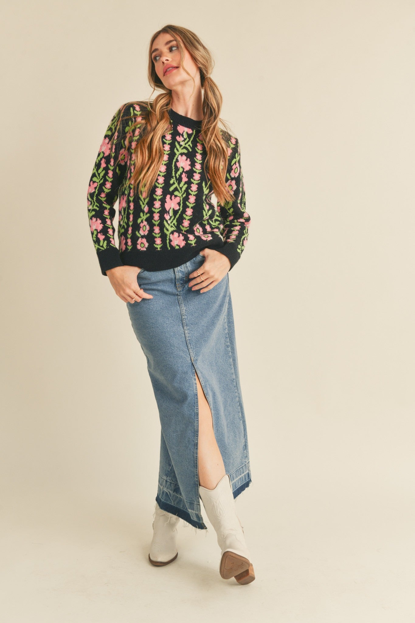 Black Betty Floral Knit sweater with a floral knit pattern. Features a ribbed round neckline, ribbed edges, and a relaxed fit.