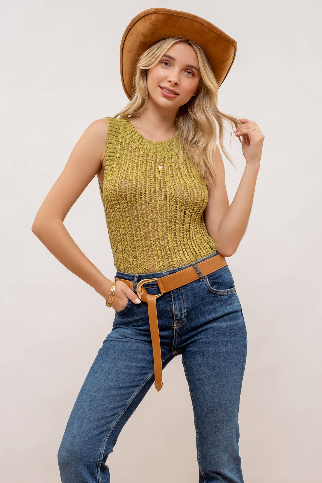 tucked in view of Kiwi Crochet Sweater Knit Tank Top with a round neckline and sleeveless design, made from 100% polyester.