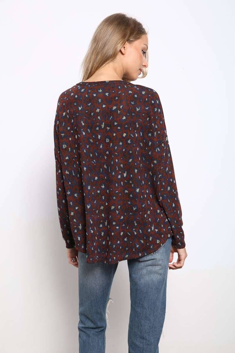 back view of Animal Print Button Front Knit Top with V-neckline, button front detail, drop shoulders, long sleeve
