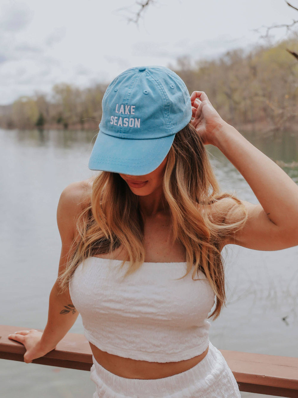 side view of Lake Season' Hat in aqua with white text, ideal for sunny days at the lake. Perfect for pairing with swimsuits and cover-ups.