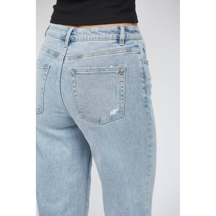 pocket view of High-rise ankle wide-leg jeans in light wash with minimal distressing. Made from 98% cotton and 2% spandex.