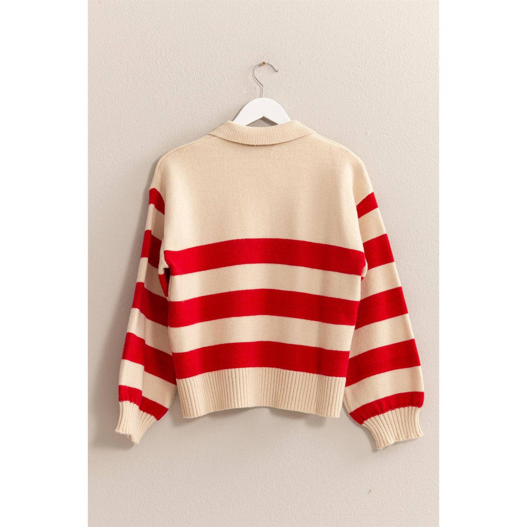 back view of red stripe of That’s So 70’s Collared Stripe Sweater with bold horizontal stripes and a relaxed fit, featuring a classic collar with a single button, available at Onyx Native.