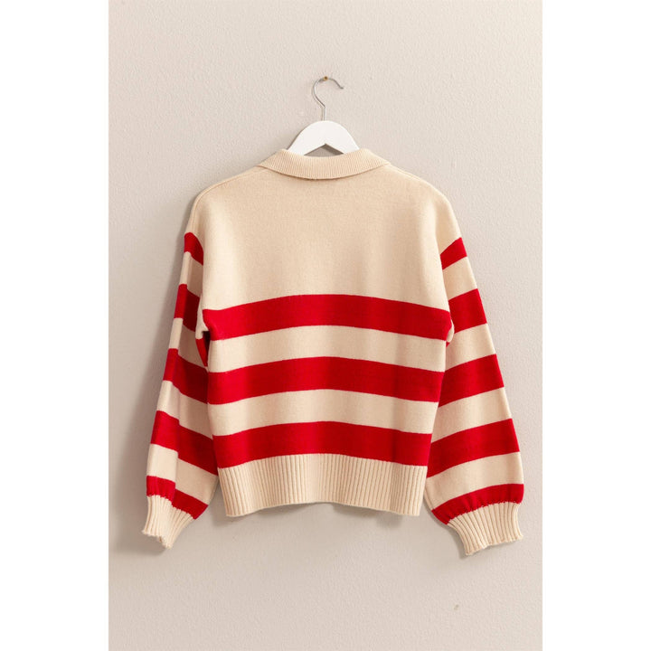 back view of red stripe of That’s So 70’s Collared Stripe Sweater with bold horizontal stripes and a relaxed fit, featuring a classic collar with a single button, available at Onyx Native.