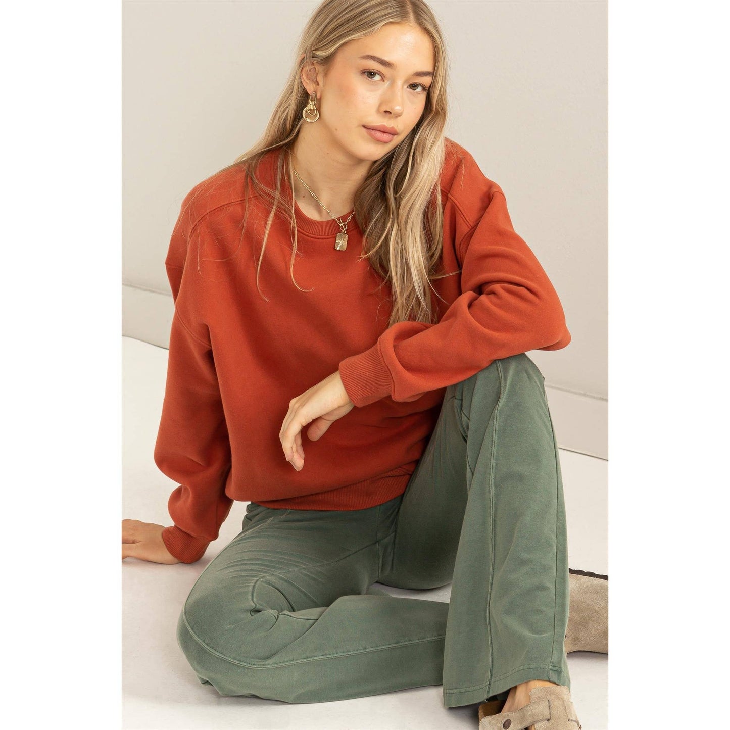 styled view of Just a Hint Drop Shoulder Sweatshirt in soft cotton blend with crewneck and long sleeves, designed in the USA, available at Onyx Native.