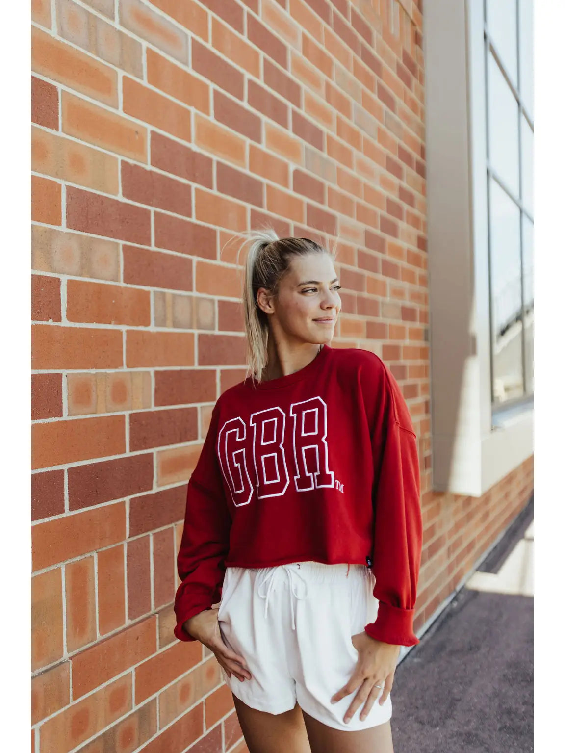 model wearing Nebraska Oversized Outline Crew - GBR Go Big Red cropped long sleeve crewneck with oversized fit from Onyx Native