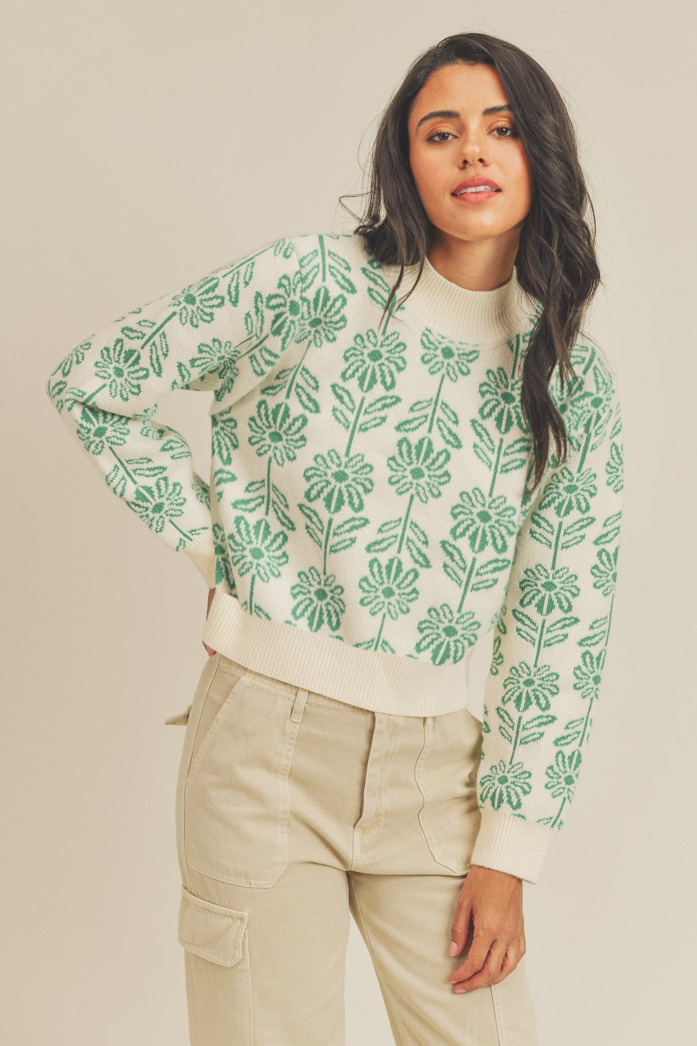 Add a touch of floral charm to your wardrobe with our Bright Green Floral Knit Sweater. This pullover sweater features a beautiful floral pattern, ribbed high round neckline, hem, and cuffs. Made from a blend of 50% viscose, 30% acrylic, and 20% polyester, it ensures both comfort and style. Perfect for a cozy yet chic look. 