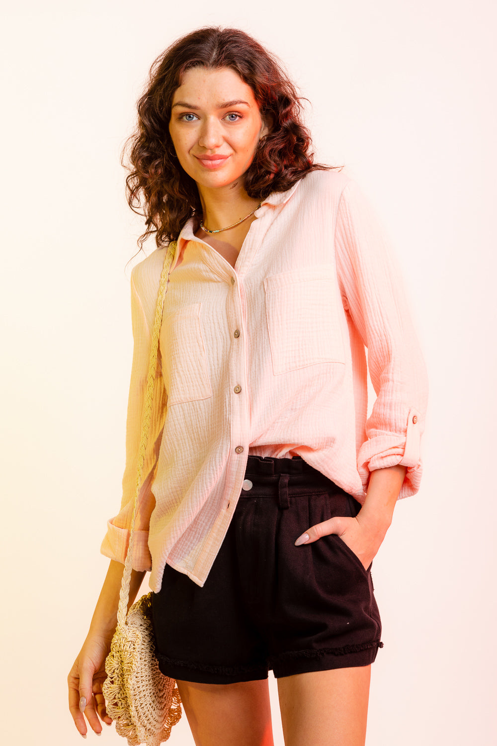 untucked view of Blushing Hem Linen Top: Long sleeve double gauze button-down shirt in 100% cotton. Features include button-down front closure, optional roll-up cuffs, round shirttail hem, straight collar, chest pockets, and back yoke.