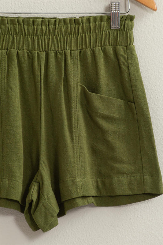 Breezy linen blend shorts with an elasticated high waistband and side pockets, made from 80% rayon and 20% linen.