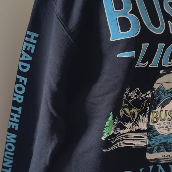 vide of Busch Light Country crewneck sweatshirt with Junkfood design, featuring hunting, fishing, and loving every day slogan. Unisex.