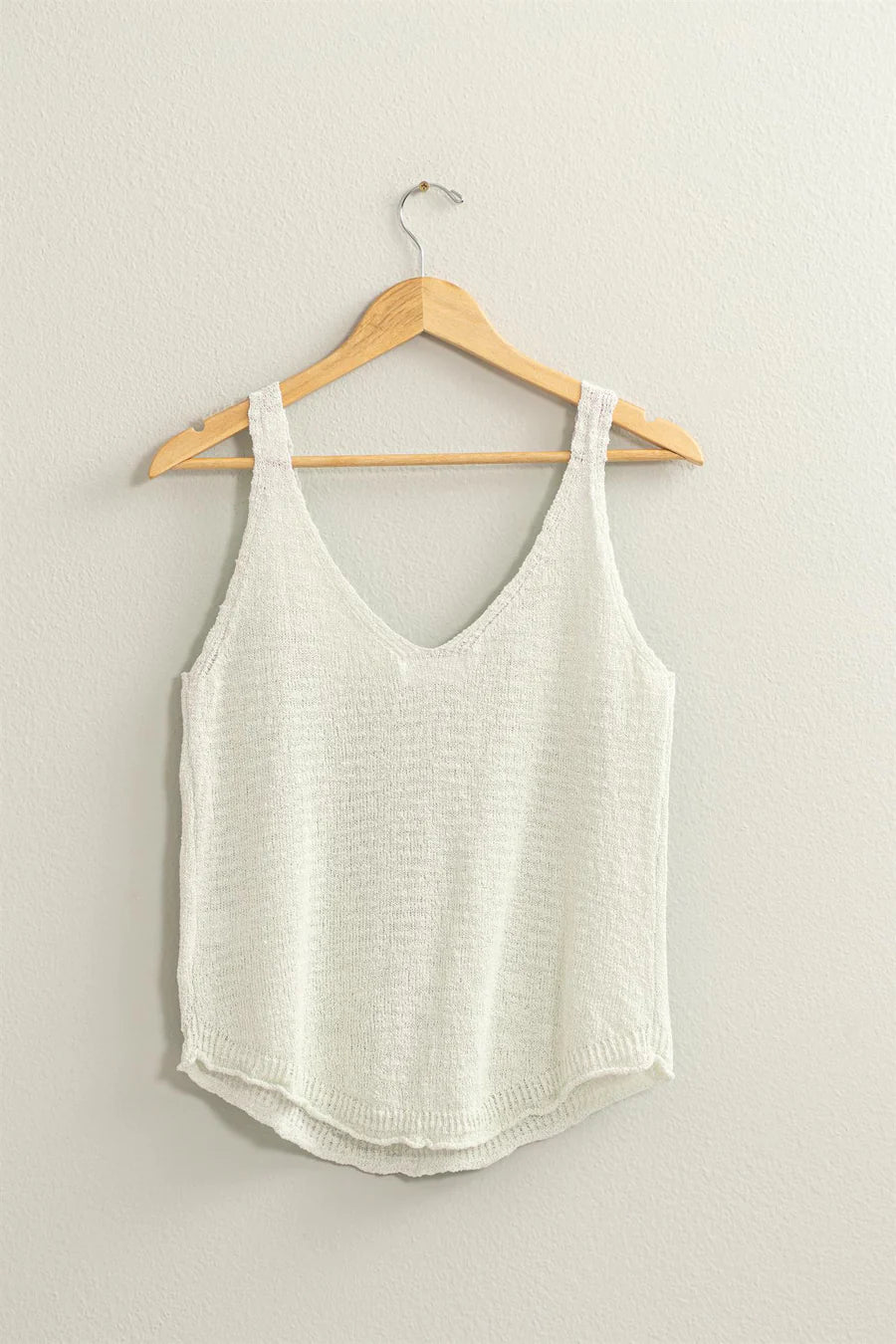 zoomed out view of white Terry Sleeveless Top with a V neck and shoulder straps, featuring a relaxed fit. Made from 75% cotton and 25% polyester, ideal for pairing with shorts, pants, or skirts