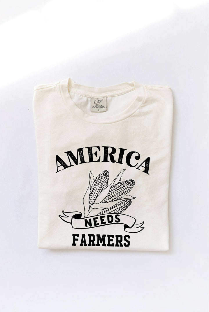 America Needs Farmers mineral washed graphic top in 100% premium cotton jersey. Features a relaxed unisex fit and screen-printed design with water-based ink. Each top is unique due to the dying process. Exclusive Oat Collective label.