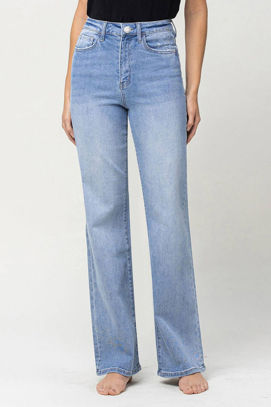 90's vintage super high rise flare jeans with comfort stretch denim, full length, and flare legs. Front rise: 11.5 inches, inseam: 32 inches, leg opening: 20 inches. Model is 5'9'' wearing size 26.