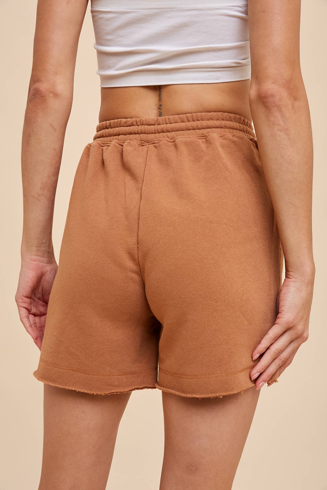 Cammy Short - Garment-washed French terry shorts with an elastic waistband, cotton tape drawstring, double edge raw fray hem detail, and deep pockets.