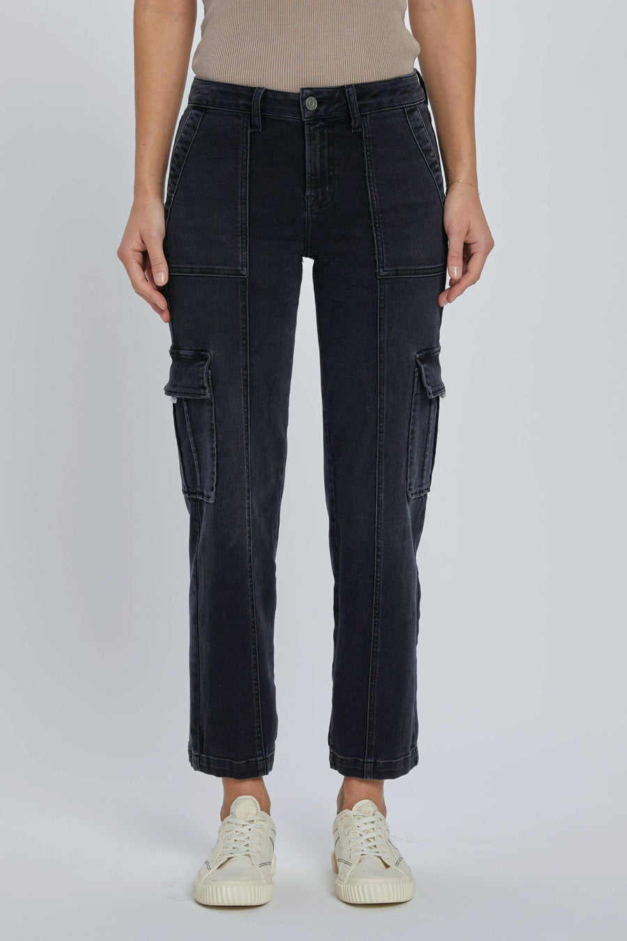 front view of Black stretch cargo pocket straight jeans. Features include a rise of 10 inches and an inseam of 28 inches. Model is wearing size 26. Made of 65% cotton, 21% rayon, 11% polyester, and 2% spandex.